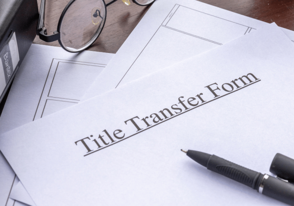 signing a title transfer form finalize home purchase lawyer for buying a house in ontario